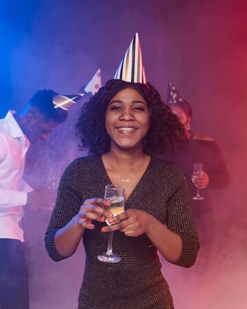 front-view-young-woman-holding-glass-champagne_23-2148757447